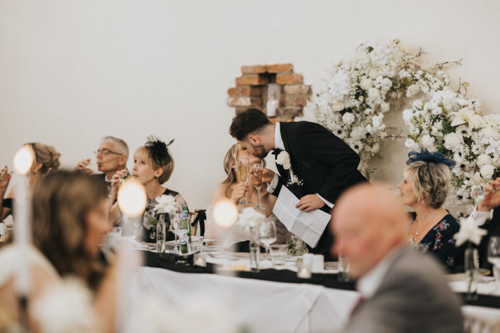 Bride and Groom celebrating their Barn Wedding at Healing Manor, during speeches