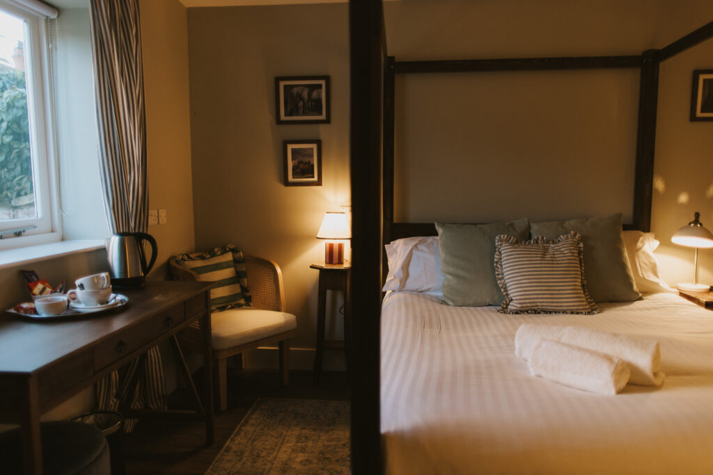 A four paster bed in a courtyard bedroom at Healing Manor. This room is a standard double bedroom.